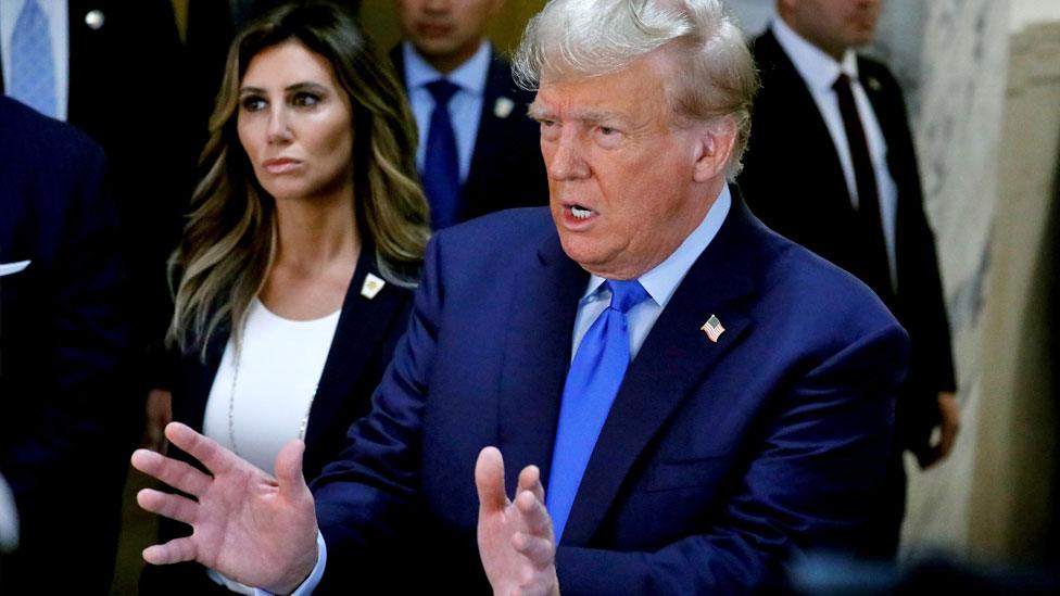 Former US President Donald J. Trump speaks to the media before he attends the first day of his civil fraud trial in New York, New York, USA, on 2 October 2023