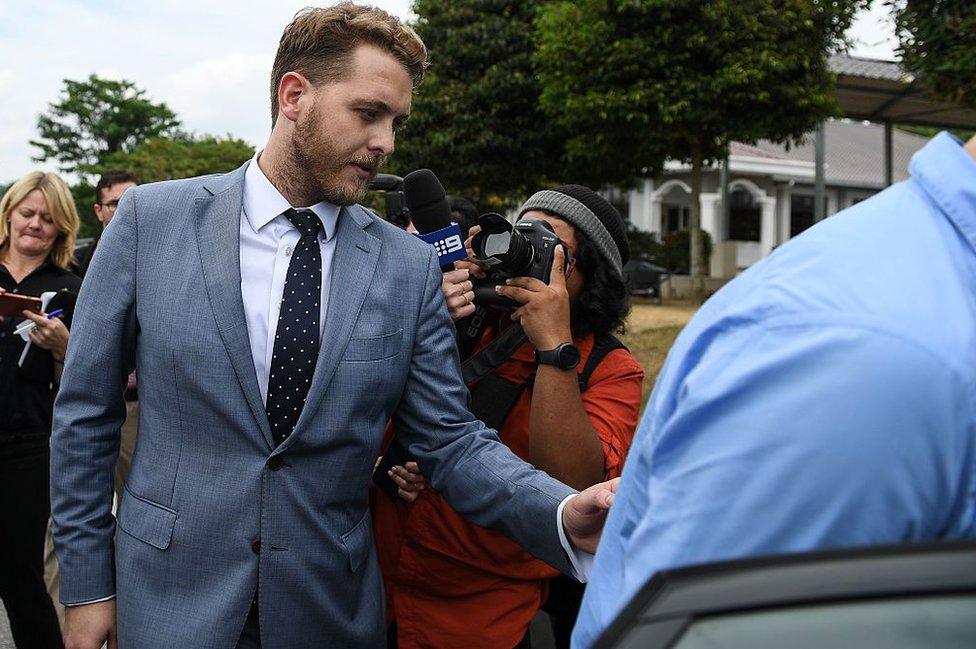 Jack Walker leaves court on Thursday after spending four days in detention in Malaysia