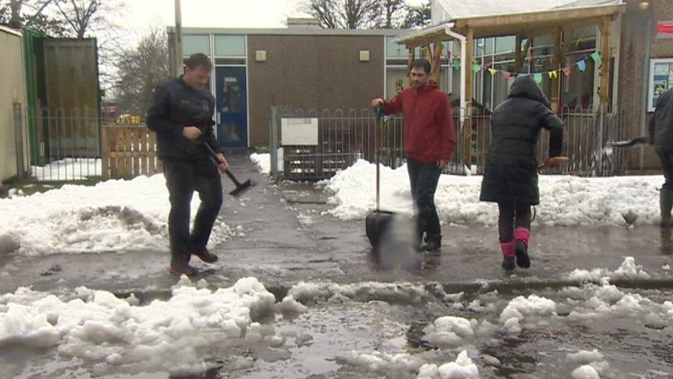 Parents helped to clear snow to allow Creigiau primary school, near Cardiff, to reopen on Monday