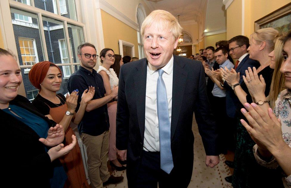 Boris Johnson greeted by staff at 10 Downing Street