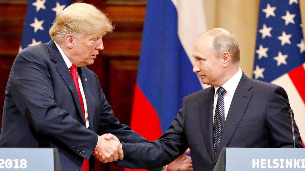 US President Donald Trump and Russian leader Vladimir Putin shake hands