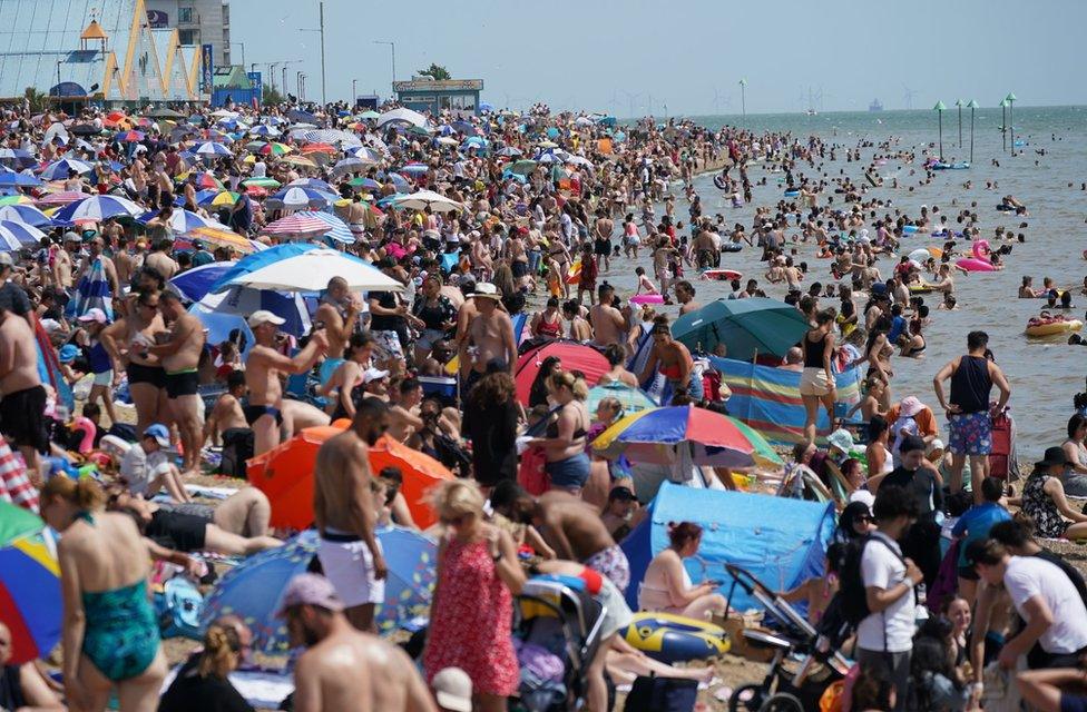 People relax on the beach at Southend-on-Sea on the Thames Estuary in Essex