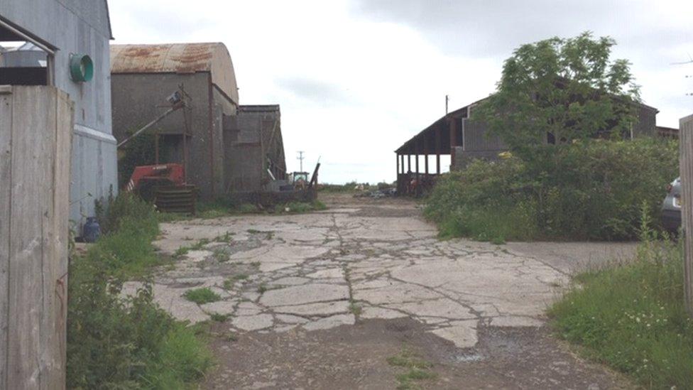 Farm buildings where the new homes will be built