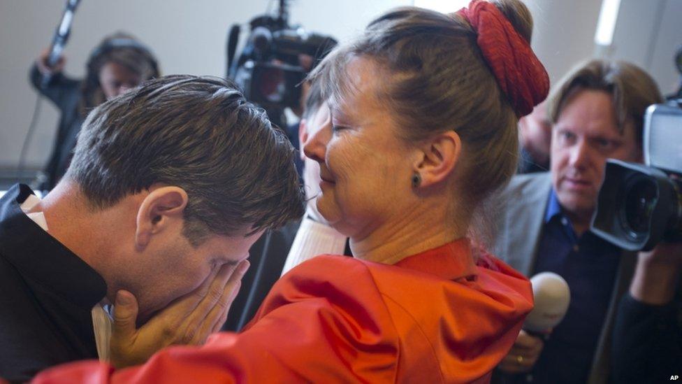 Urgenda Foundation director Marjan Minnesma hugs lawyer Roger Cox, left, after a Dutch court ordered the government to cut the country"s greenhouse gas emissions by at least 25%