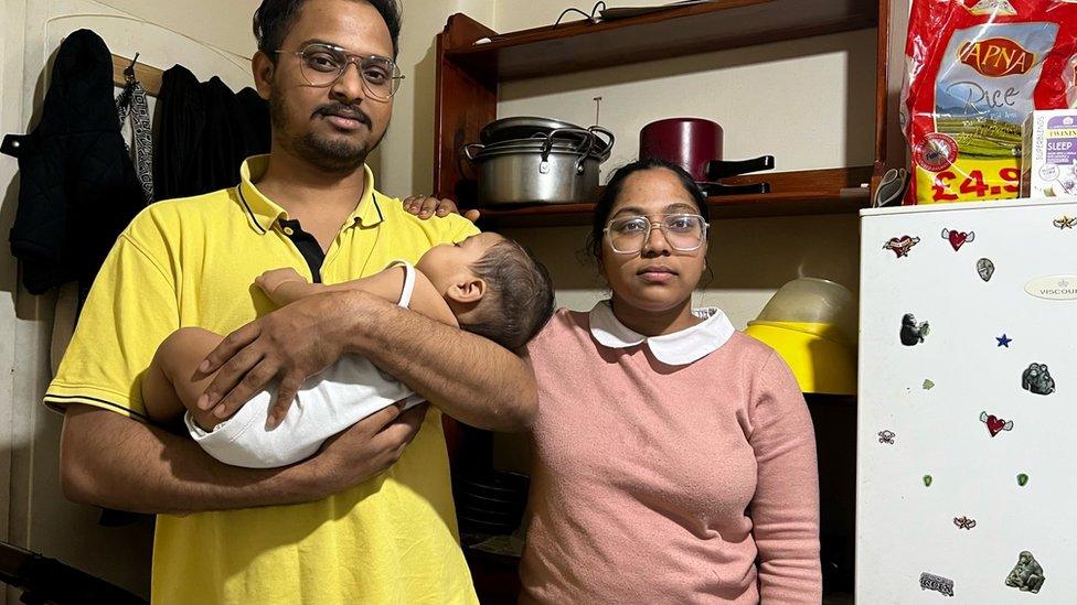 Arshi Begum with her husband and their baby son