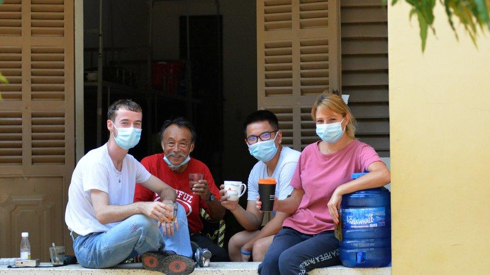 Mr Ngo and Mr Chinn with Italian citizens at the camp