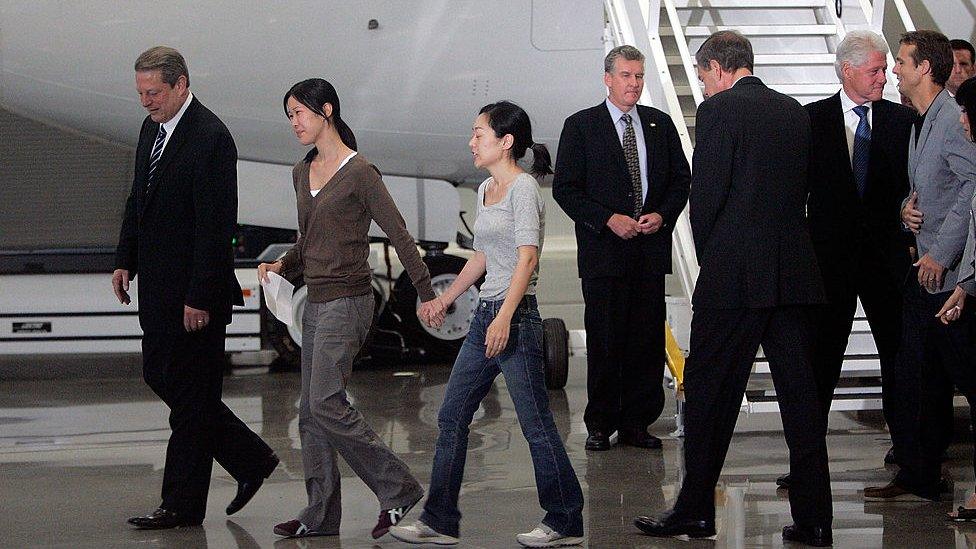 Laura Ling and Eura Lee with Bill Clinton