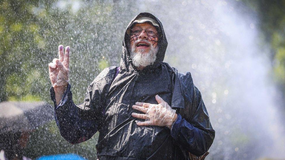 A protester gestures as Extinction Rebellion activists block the A12, during the 'XR opposes fossil subsidies' demonstration in The Hague, The Netherlands, 27 May 2023.