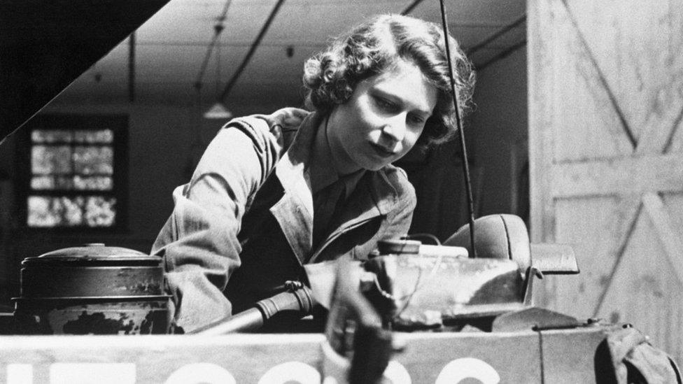 Princess Elizabeth, heir apparent to the throne of England, is shown checking the motor of an army vehicle during her training at an auxiliary territorial service depot on Southern England