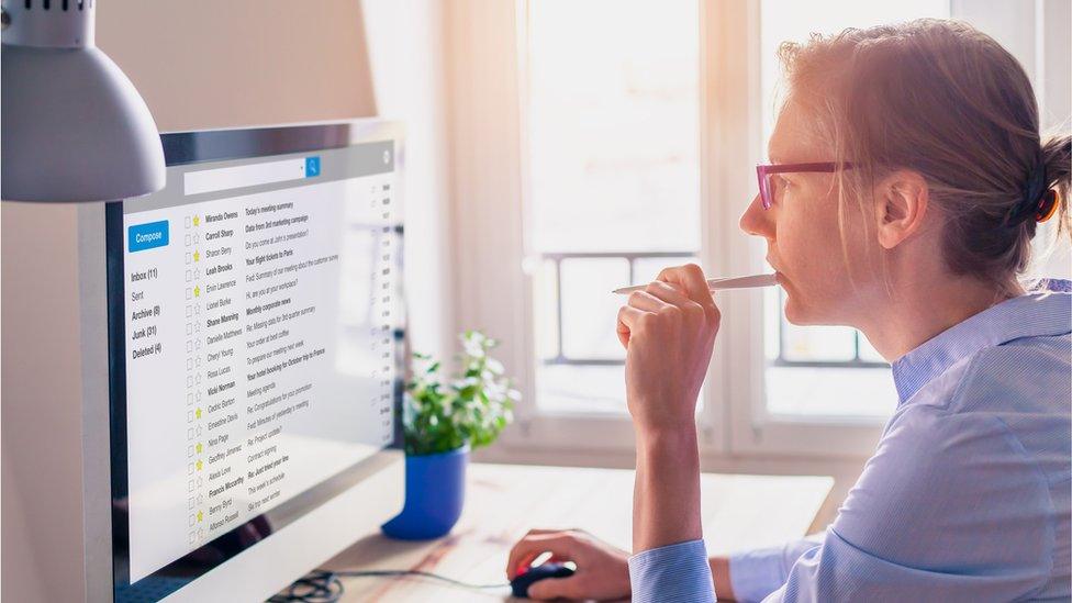 Woman in front of computer screen