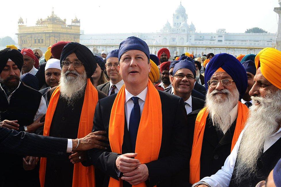 ritish Prime Minister David Cameron (C) along with Punjab State Chief Minister Parkash Singh Badal (2L), and Shiromani Gurdwara Parbandhak Committee (SGPC) President Avtar Singh Makkar (2R) visit the Sikh Shrine Golden temple in Amritsar on February 20, 2013