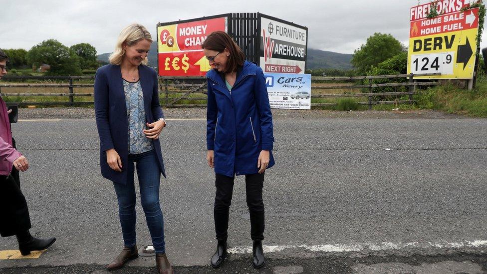 Irish minister Helen McEntee and the French Minister for Europe AmŽile de Montchalin stand on either side of the border on 19 July