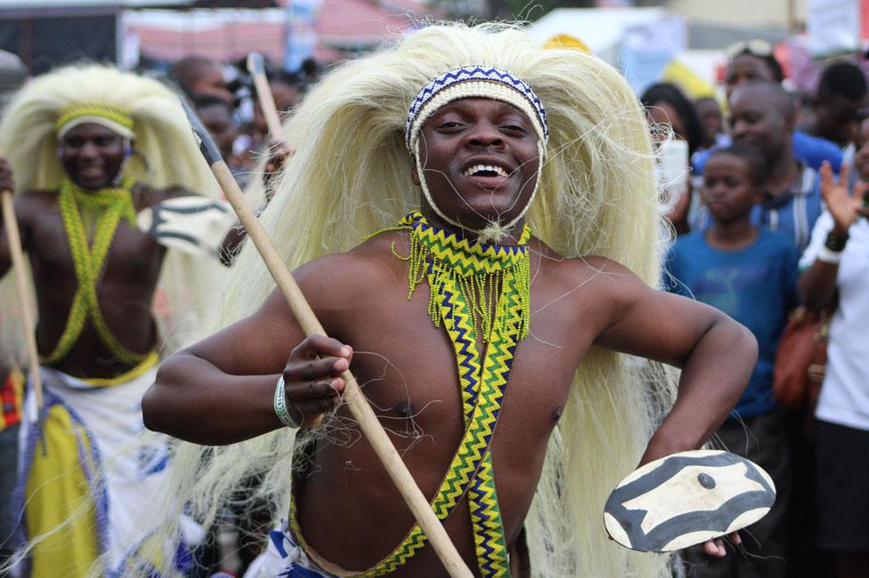 Man wearing a headdress dancing