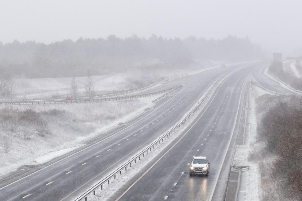 Snow falls on the A14 near Stowmarket, in Suffolk, on 7 February 2021