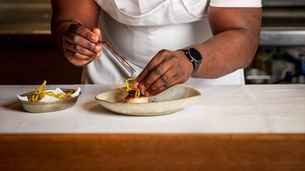 Akoko chef Ayo Adeyemi preparing a dish