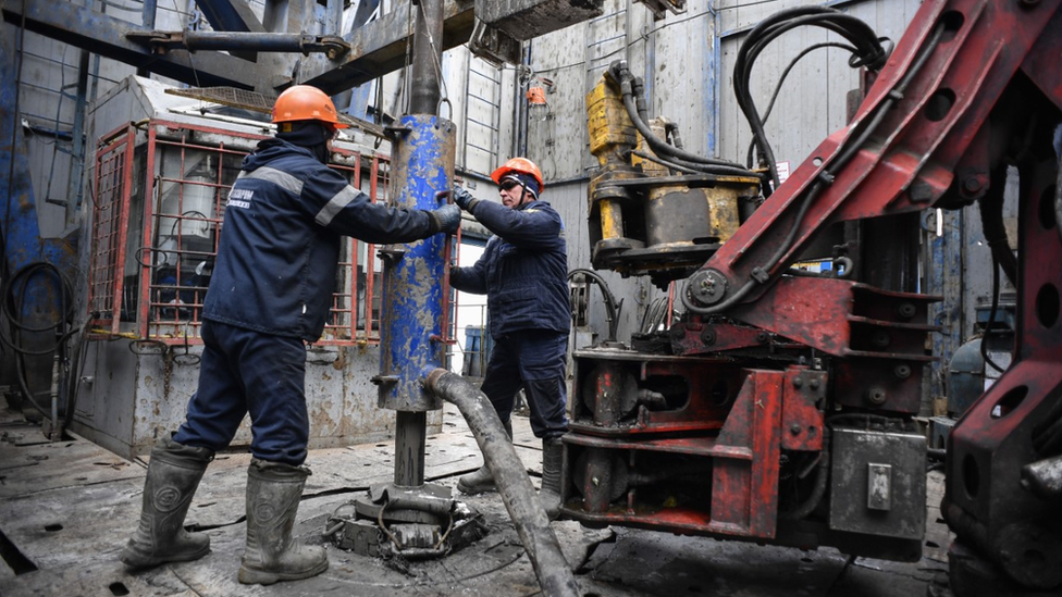 Workers on a Gazprom gas rig in Western Russia