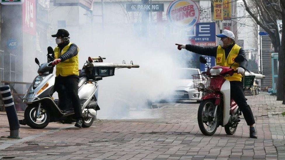 Workers on scooters disinfect the streets of Daegu, South Korea. Photo: 21 February 2020