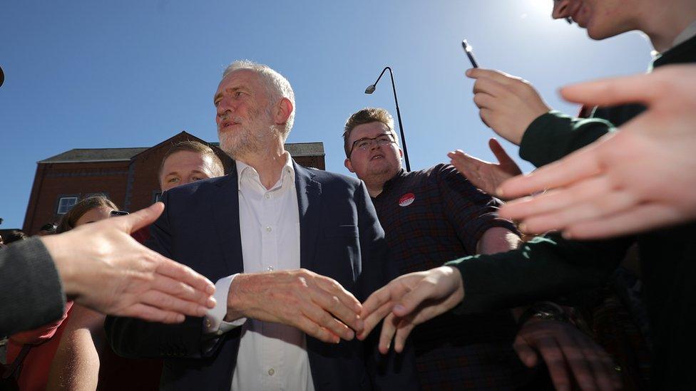 Jeremy Corbyn shakes hands with supporters