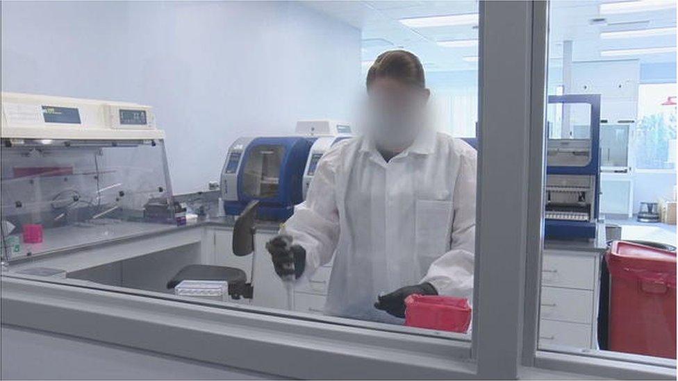 A CBI investigator in the crime lab