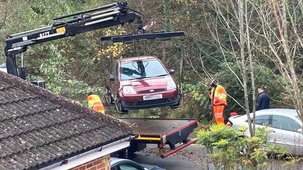 Cars being lifted