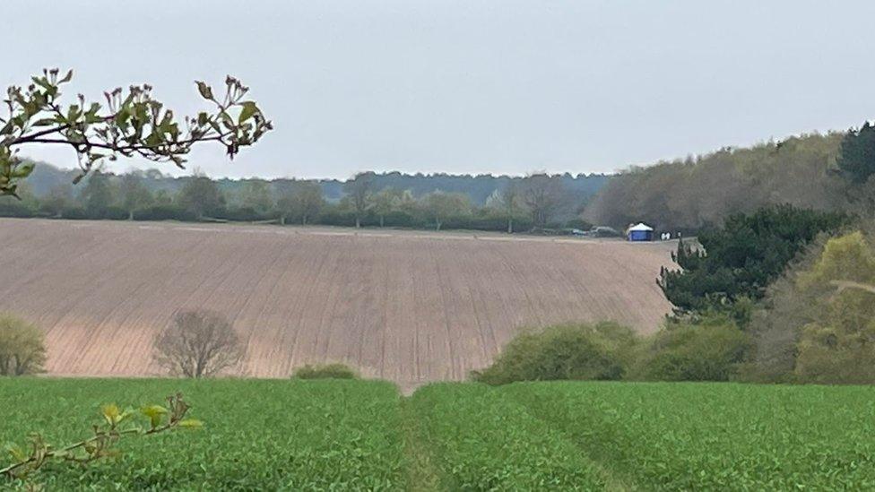 Police tent in a field