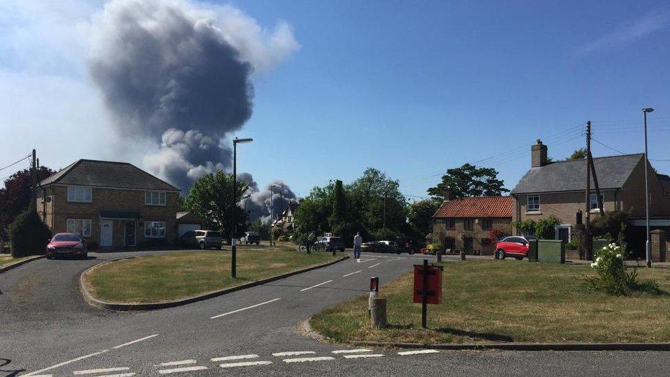 Plumes of smoke rising from the Corkers Crisps factory in Pymoor, Cambridgeshire