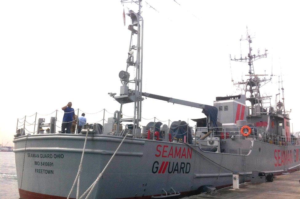 Indian personnel stand on the deck of the Seaman Guard Ohio at a dock in Tuticorin in October 2013.