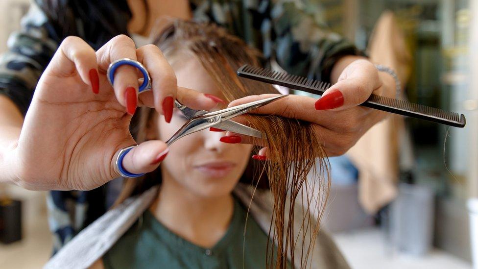 Woman getting a haircut