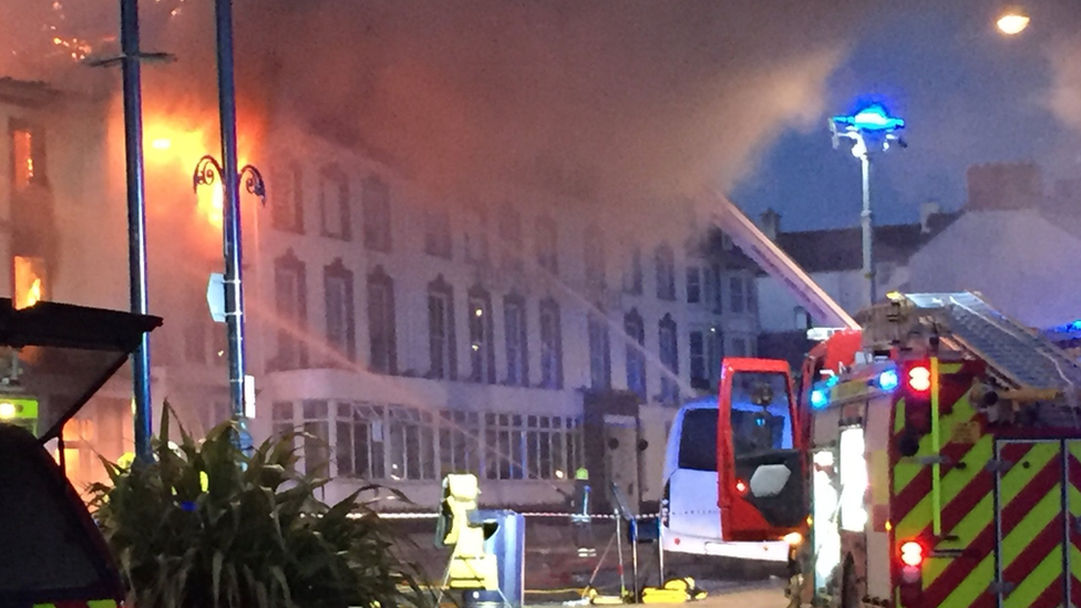 Fire engine spraying water at the hotel fire