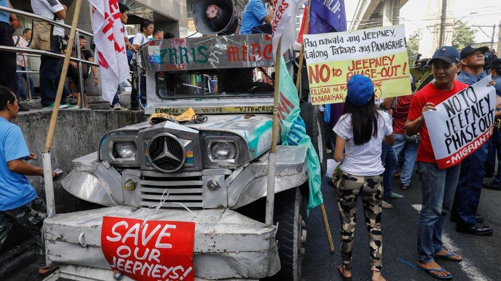 Demonstrators protest against an alleged government plan to phase-out old jeepneys