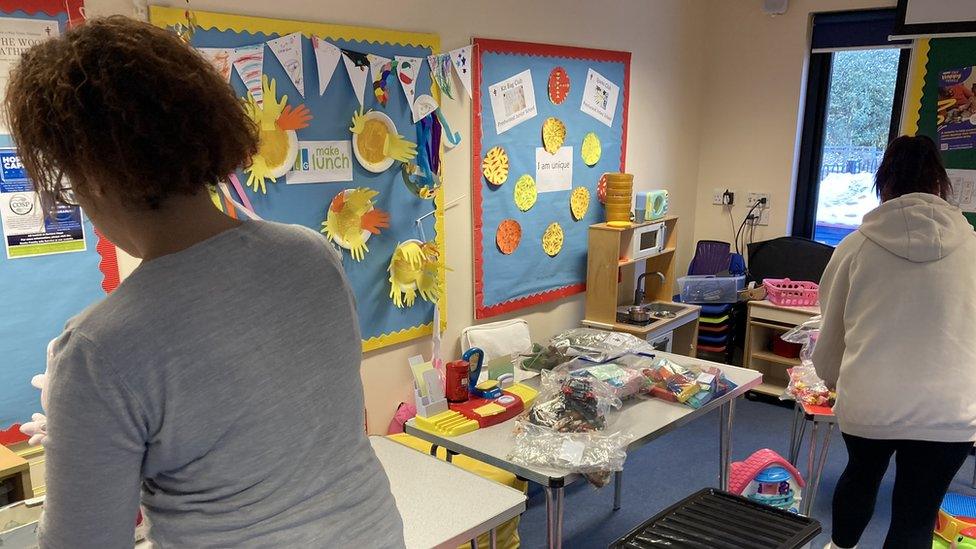 Sam and Anne-Marie, two foodbank users, helping out at the local toy library