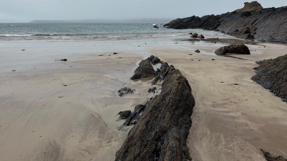 Beach with rocky outcrop