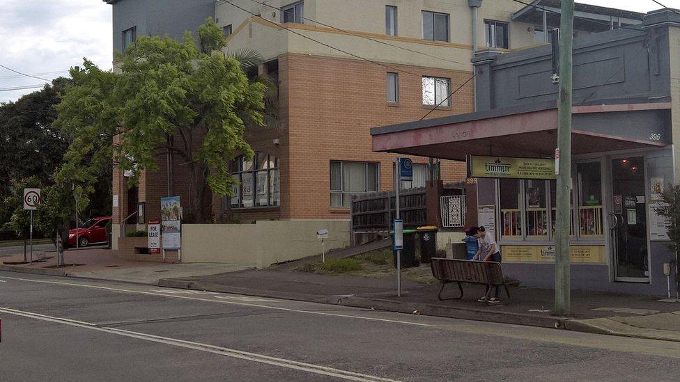 A bus stop outside a shop, where the unidentified man began his final bus trips