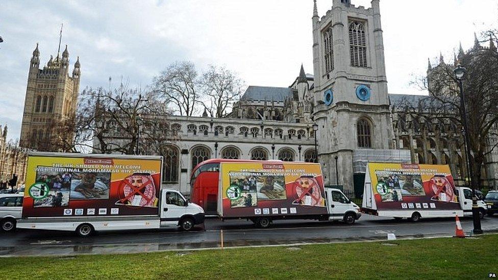 Vans carrying billboards protesting at the Crown Prince's visit