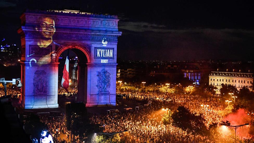 The Arc de Triomphe in Paris with Mbappe's face projected on to it