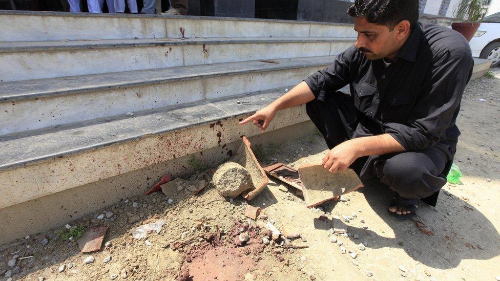 A Pakistani security officials surveys the Abdul Wali Khan University where student Mashal Khan was killed by a mob