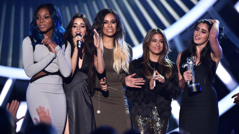 Fifth Harmony collecting their award at the 2014 VMAs