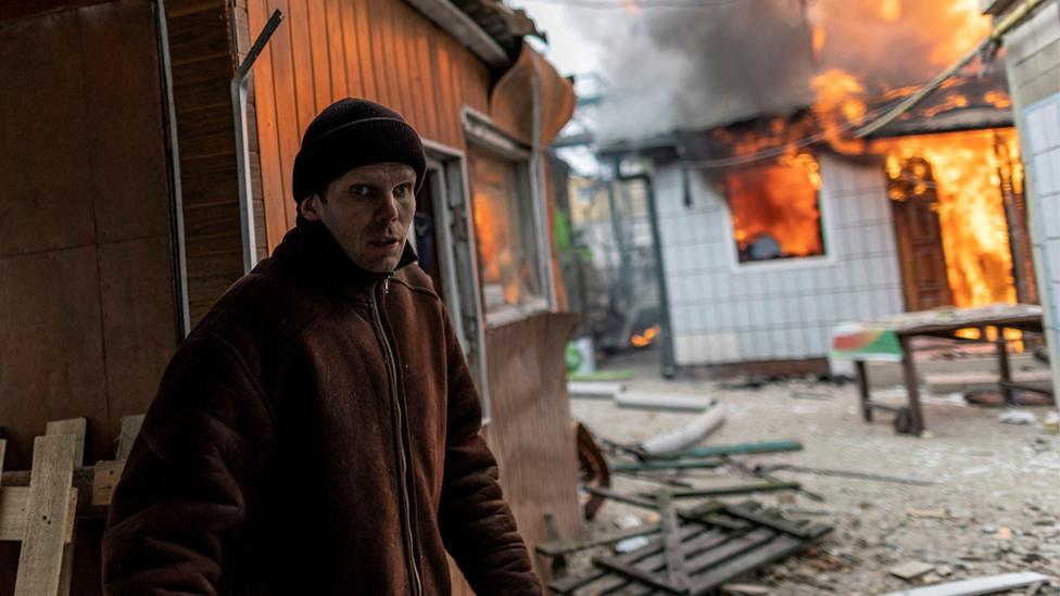 A resident in Irpin, near Kyiv, after the only escape route was shelled as Russian forces advance towards the capital