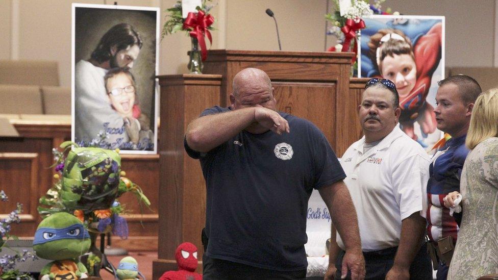 Townville Fire Chief Billy McAdams wipes away tears before the funeral