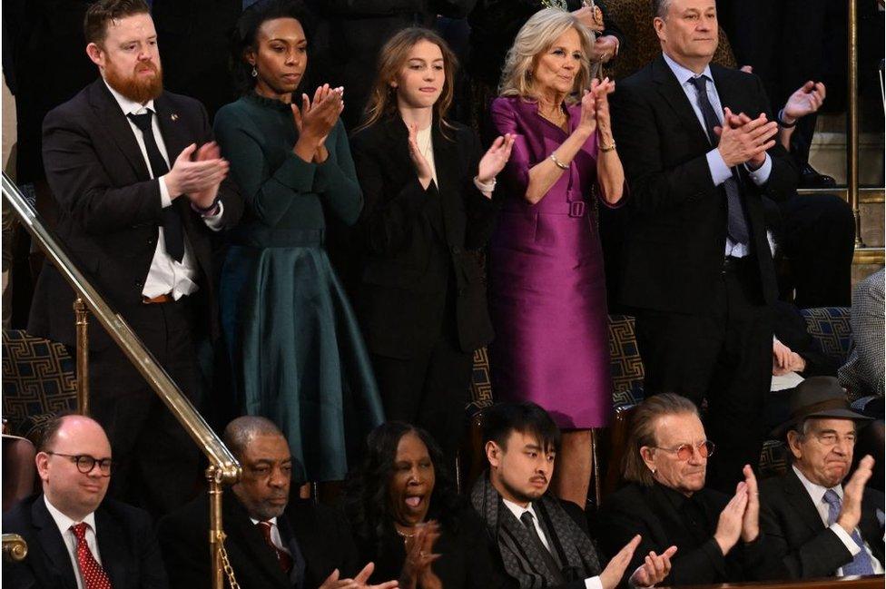 First Lady Jill Biden, in purple, seen with guests of the White House