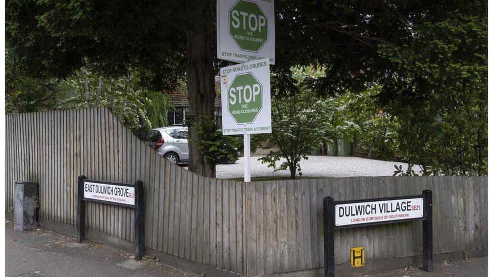 Anti-LTN signs on street corner