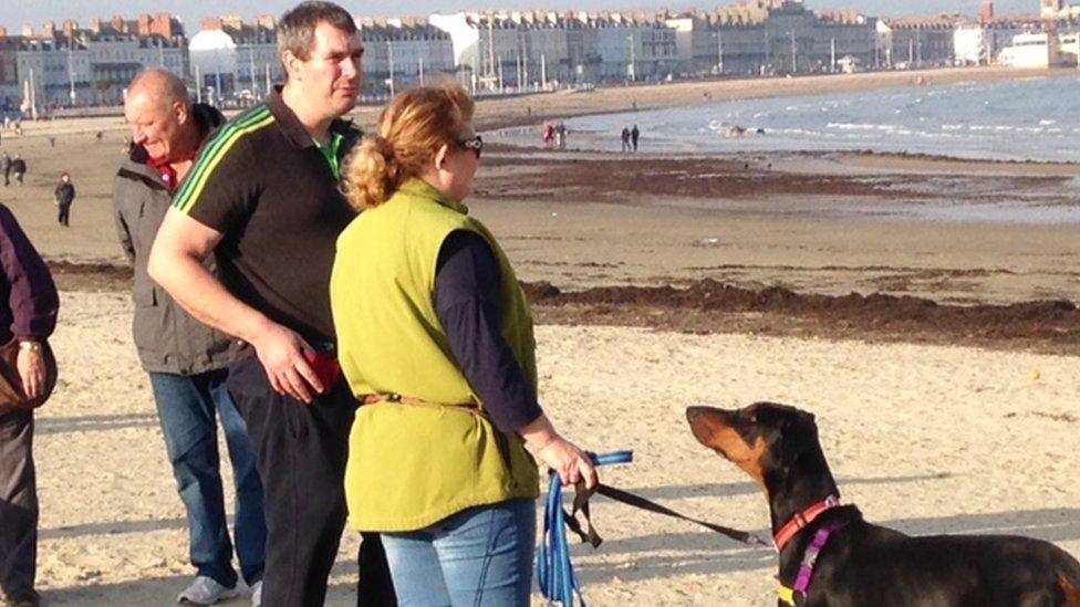 Dog owners on Weymouth beach