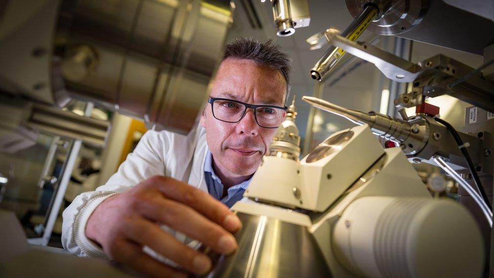 Professor John McGeehan, at the University of Portsmouth looking at a microscope