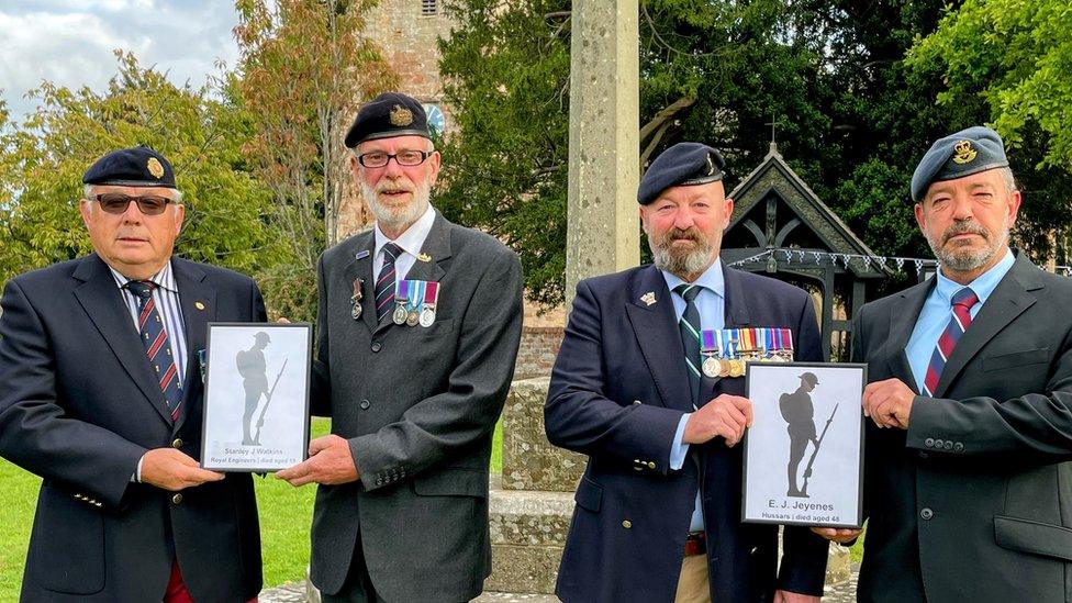 Veterans in front of monument