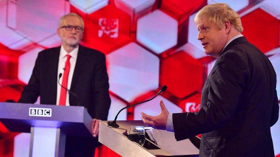 Boris Johnson and Jeremy Corbyn stand at their podiums