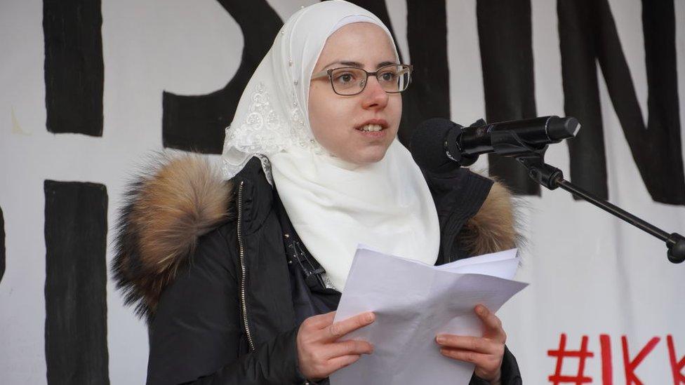 Faeza Satouf speaks during protest the government's plan to deport Syrian refugees