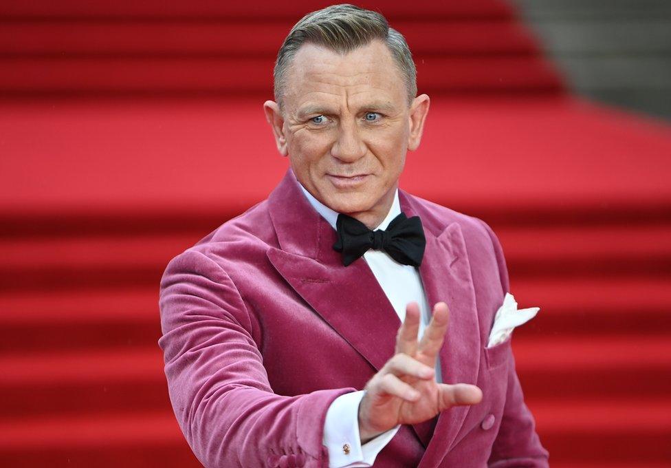 Daniel Craig in fuschia velvet dinner jacket