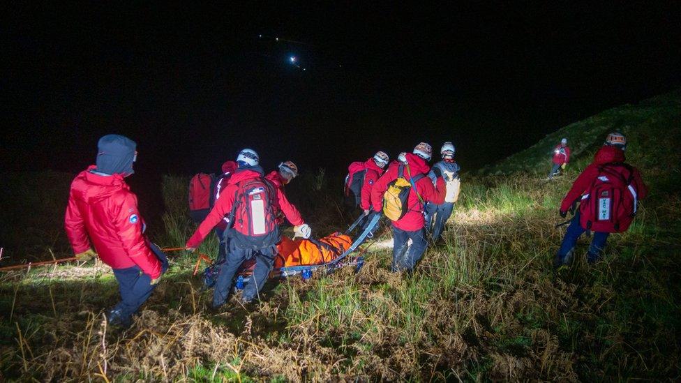 Man being stretchered to safety