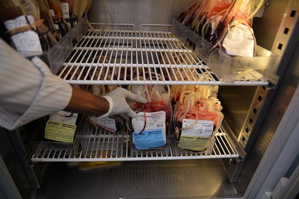 An Indian medical assistant arranges packs of donated blood at a blood transfusion clinic in New Delhi on June 1, 2016. More than 2,000 Indians contracted HIV over a 17-month period after receiving blood transfusions, data from the national AIDS body showed June 1.