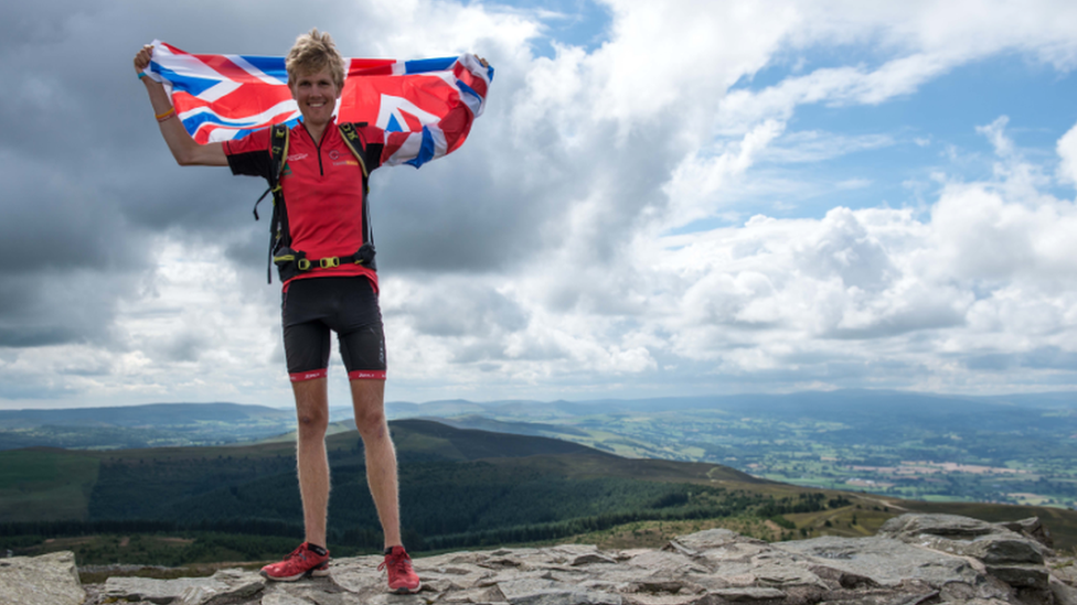 Alex Staniforth at the summit of Moel Famau